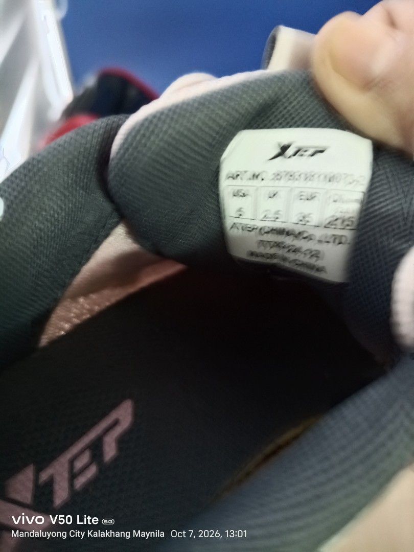 Adidas and Xtep Sneaker Bundle (Category: Sneakers) located in Manila. Submitted by prettylook48762 (Listing ID 1466385532, Image 2). Description: - Sneaker bundle deal (2 pairs for 1 price) - Pair 1: White Adidas vegan slip-ons with textured uppers - Pair 2: Pink and grey Xtep laced running shoes - Size: US 6 / UK 3.5 / EUR 36 (applicable to both or general bundle size) - Condition: Visible signs of wear, with dirt on soles and insoles - Perfect