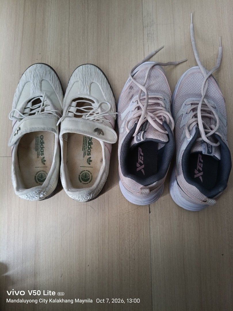 Adidas and Xtep Sneaker Bundle (Category: Sneakers) located in Manila. Submitted by prettylook48762 (Listing ID 1466385532, Image 1). Description: - Sneaker bundle deal (2 pairs for 1 price) - Pair 1: White Adidas vegan slip-ons with textured uppers - Pair 2: Pink and grey Xtep laced running shoes - Size: US 6 / UK 3.5 / EUR 36 (applicable to both or general bundle size) - Condition: Visible signs of wear, with dirt on soles and insoles - Perfect