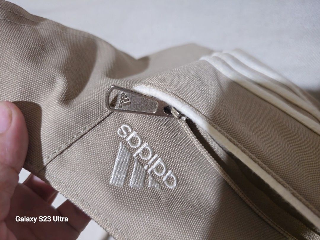 Adidas Authentic Sling/Body Bag (Category: Tote Bags) located in Quezon City. Submitted by bagsforless16 (Listing ID 1466489643, Image 2). Description: Front Zip Compartment Main Zip Compartment with Organizer Back Zip Compartment With Tags and Logos Adjustable Strap Lightweight Denim Very Clean In & Out Size: 15" x 8" x 5".