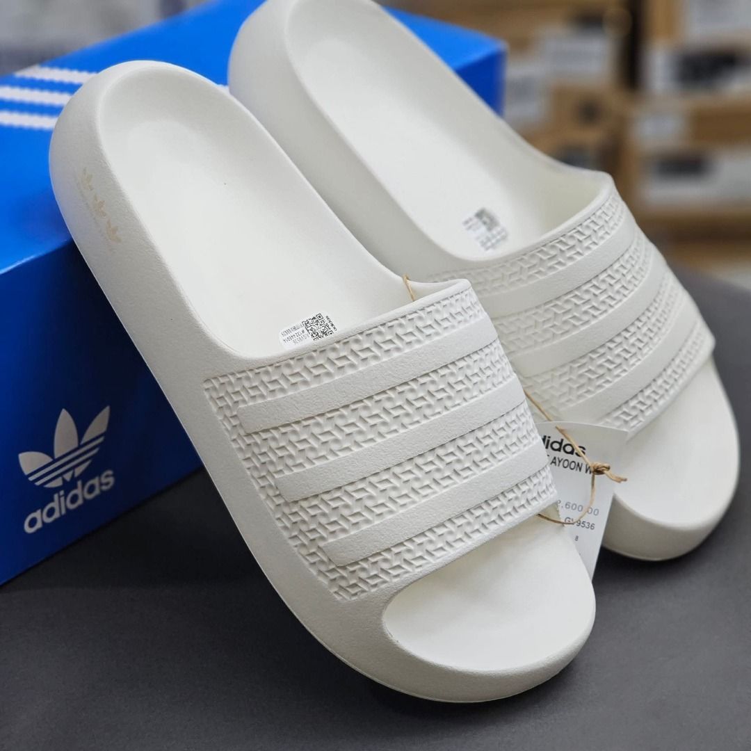 Adidas Ayoon Slides White (Category: Slippers and slides) located in Rizal. Submitted by hiraya16 (Listing ID 1464103440, Image 2). Description: Us6 23.5 Available Onhand ready to ship. DM ✉️ One of my favorite slides, super soft when worn..Perfect for long walks. Lightweight. J&T - Lalamove - LBC.