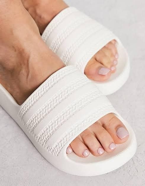 Adidas Ayoon Slides White (Category: Slippers and slides) located in Rizal. Submitted by hiraya16 (Listing ID 1464103440, Image 3). Description: Us6 23.5 Available Onhand ready to ship. DM ✉️ One of my favorite slides, super soft when worn..Perfect for long walks. Lightweight. J&T - Lalamove - LBC.