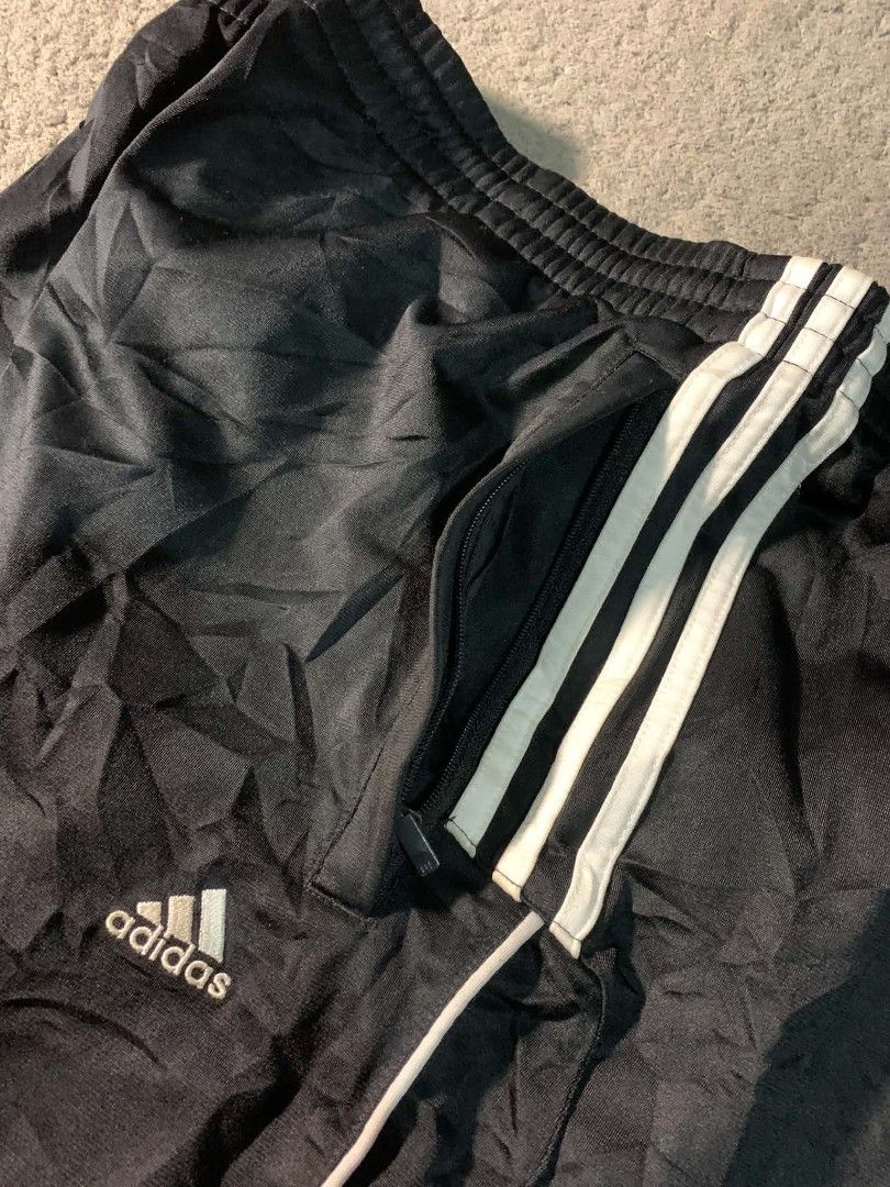 Adidas Black Track Pants with White Stripes (Category: Joggers) located in Tandag. Submitted by vncntmrcllns (Listing ID 1466408173, Image 3). Description: ADIDAS TRACK PANTS (fav🔥) Waist: ADJUSTABLE GARTERIZE WITH LACE Length: 40 Hem: 10-11 -Excellent Condition (As new) -Already wash -Color rate 10/10 All details are visible in the picture Please check each photo - Color: Black with iconic white three stripes - Fit: Comfortable elastic waistban