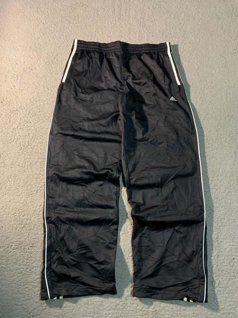 Adidas Black Track Pants with White Stripes (Category: Joggers) located in Tandag. Submitted by vncntmrcllns (Listing ID 1466408173, Image 2). Description: ADIDAS TRACK PANTS (fav🔥) Waist: ADJUSTABLE GARTERIZE WITH LACE Length: 40 Hem: 10-11 -Excellent Condition (As new) -Already wash -Color rate 10/10 All details are visible in the picture Please check each photo - Color: Black with iconic white three stripes - Fit: Comfortable elastic waistban