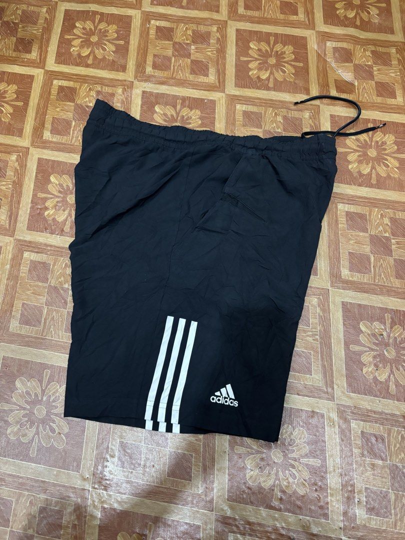 Adidas Climacool Black Shorts Size 105 (Category: Activewear) located in Manila. Submitted by noribrahim.20 (Listing ID 1466557527, Image 2). Description: - Brand: Adidas - Color: Black with classic white three stripes and logo - Size: Tag 105 - Material/Tech: Climacool fabric for breathability and sweat-wicking - Features: Elastic waistband with adjustable black drawstring - Origin: Made in Thailand - Condition: Great for workouts, running, or c