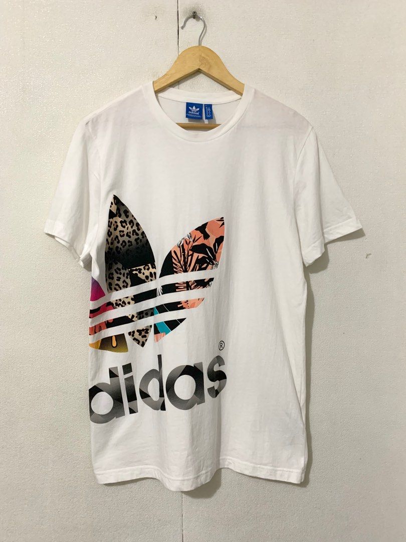 Adidas men white cotton top (Category: Tshirts & Polo Shirts ) located in Calamba. Submitted by melaicas (Listing ID 1466457571, Image 2). Description: Armpit laid flat-20 inches Length-29 inches .