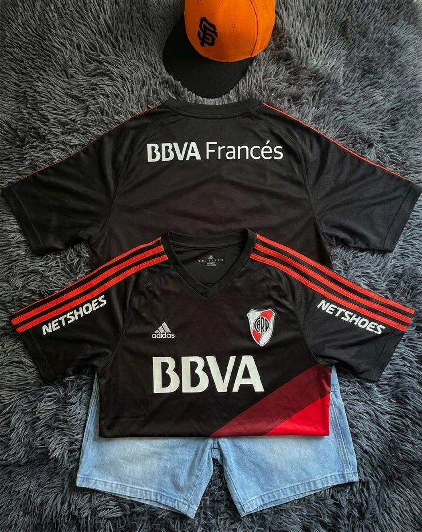 Adidas River Plate Black Red Jersey Netshoes BBVA (Category: Activewear) located in Caloocan City. Submitted by nobleturtle.67b122 (Listing ID 1466508266, Image 2). Description: - Authentic Adidas River Plate football jersey in iconic black and red - Features official Netshoes sleeve sponsors and BBVA chest/back sponsors - Built with breathable Adidas Climacool technology fabric - Classic short sleeve design with signature three stripes.