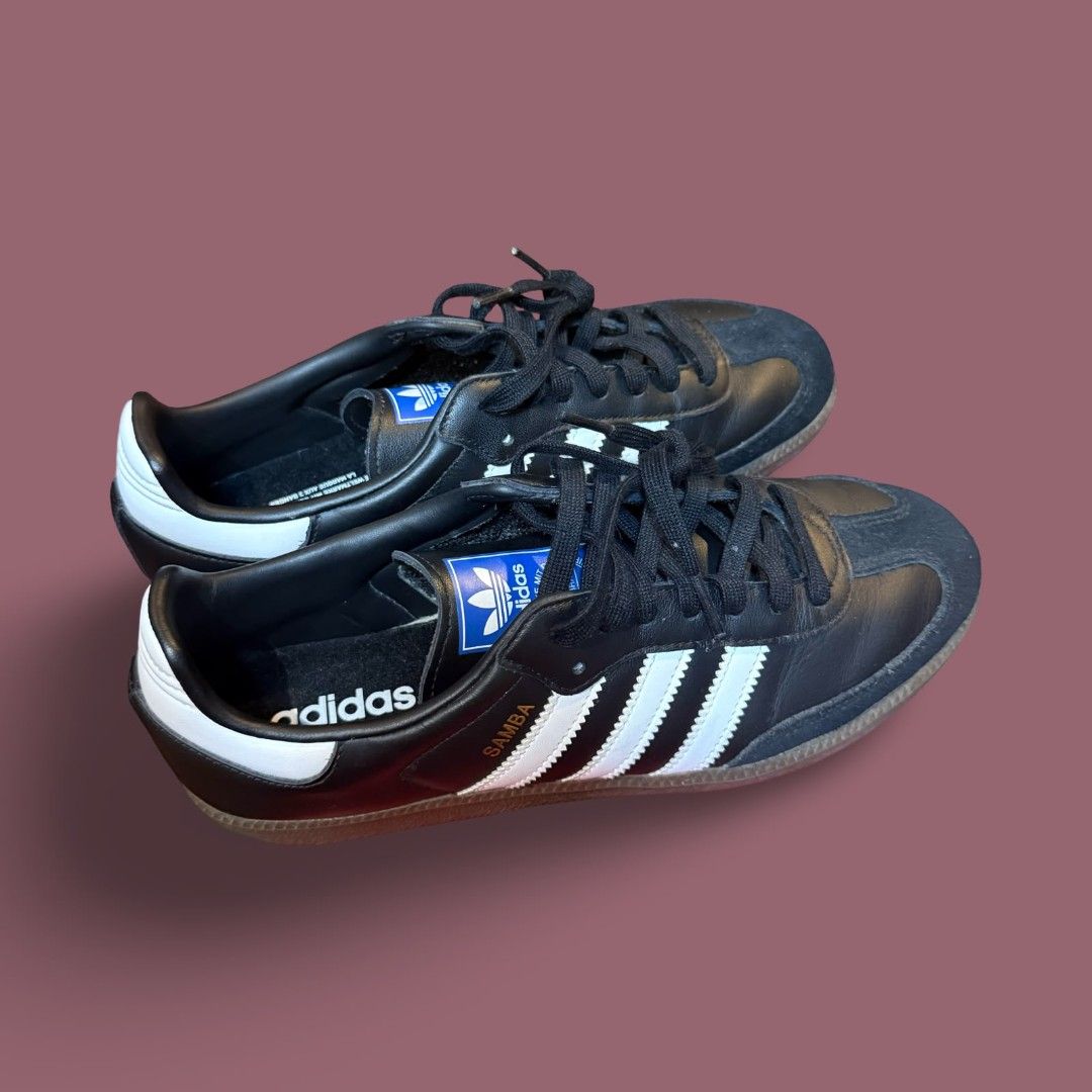 Adidas Samba Classic Black White Sneakers (Category: Casual Shoes) located in Del Monte. Submitted by jasonjuan31 (Listing ID 1466496533, Image 1). Description: - Model: Adidas Samba Classic - Color: Black leather with white stripes and gold lettering - Details: Suede toe overlay, gum soles, and blue tongue labels with white trefoil logo - Laces: Includes standard black laces - Style: Retro-inspired, perfect for casual everyday wear - Condition: 