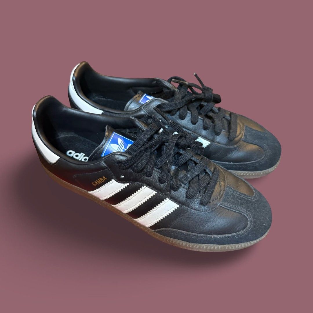 Adidas Samba Classic Black White Sneakers (Category: Casual Shoes) located in Del Monte. Submitted by jasonjuan31 (Listing ID 1466496533, Image 3). Description: - Model: Adidas Samba Classic - Color: Black leather with white stripes and gold lettering - Details: Suede toe overlay, gum soles, and blue tongue labels with white trefoil logo - Laces: Includes standard black laces - Style: Retro-inspired, perfect for casual everyday wear - Condition: 
