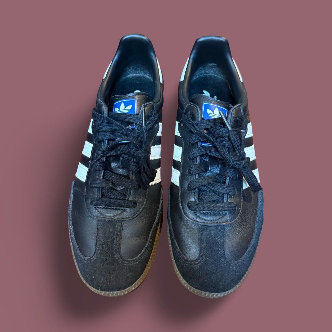 Adidas Samba Classic Black White Sneakers (Category: Casual Shoes) located in Del Monte. Submitted by jasonjuan31 (Listing ID 1466496533, Image 2). Description: - Model: Adidas Samba Classic - Color: Black leather with white stripes and gold lettering - Details: Suede toe overlay, gum soles, and blue tongue labels with white trefoil logo - Laces: Includes standard black laces - Style: Retro-inspired, perfect for casual everyday wear - Condition: 