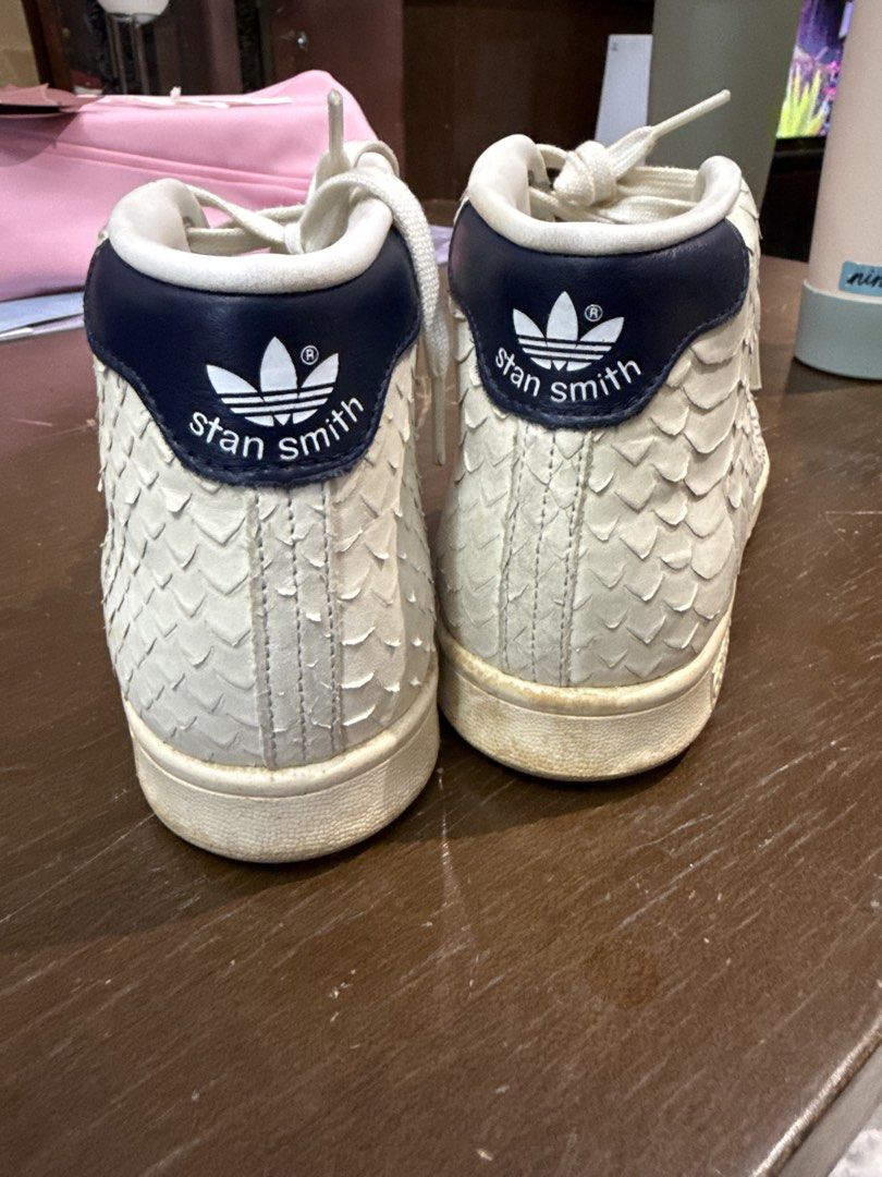 Adidas Stan Smith Mid Snake Scale High Top Sneakers (Category: Sneakers) located in Quezon City. Submitted by nsseller (Listing ID 1466460645, Image 3). Description: - Brand: Adidas - Model: Stan Smith Mid - Colorway: Off-White (Snakeskin textured) with Navy Blue heel tab - Details: Classic trefoil logo, white laces, and rubber cupsole - Condition: Noticeable stain on one lace and minor scuffs on the midsole, but overall lots of life left - Perfe