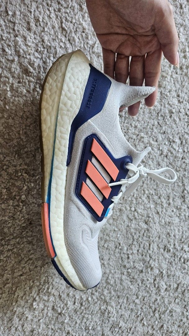 Adidas Ultraboost Light Running Shoes (Category: Sneakers) located in Antipolo. Submitted by karrenaguas (Listing ID 1466434629, Image 2). Description: - Brand: Adidas Ultraboost - Colorway: Grey with bright orange and navy accents - Size: US 7.5 / UK 6 / FR 39 1/3 - Soles: White Boost midsole with durable rubber outsole - Condition: Noticeable wear on midsoles and a small tear on the inner collar lining near the heel tag - Usage: Perfect as comf