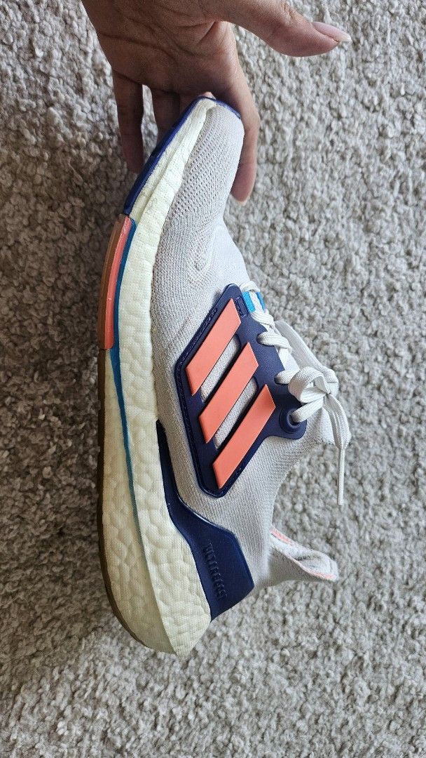 Adidas Ultraboost Light Running Shoes (Category: Sneakers) located in Antipolo. Submitted by karrenaguas (Listing ID 1466434629, Image 3). Description: - Brand: Adidas Ultraboost - Colorway: Grey with bright orange and navy accents - Size: US 7.5 / UK 6 / FR 39 1/3 - Soles: White Boost midsole with durable rubber outsole - Condition: Noticeable wear on midsoles and a small tear on the inner collar lining near the heel tag - Usage: Perfect as comf