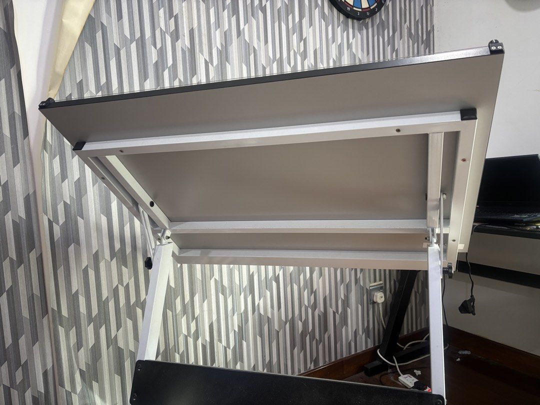 Adjustable Drafting Table (Category: Tables & Sets) located in Kuala Lumpur. Submitted by aimil__ (Listing ID 1466371436, Image 2). Description: ! WTS ! - Large white drafting board with smooth, clean surface - Sturdy metal frame with adjustable angle mechanism - Built-in horizontal parallel motion straightedge - Convenient lower shelf for storage and supplies - Minor signs of prior usage, overall in great working condition Price : RM150 (negotia