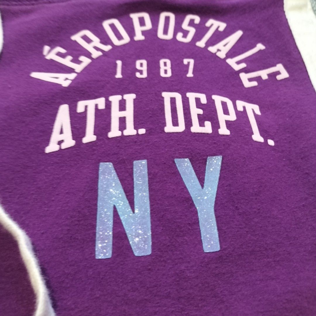 Aeropostale Purple Sweatpants Size L (Category: Joggers) located in Taytay. Submitted by calmtree-6248 (Listing ID 1466443554, Image 3). Description: Purple Aeropostale stretch sweatpants in size large. White side stripes down both legs. Drawstring waist with metallic grommets. Aeropostale 1987 Ath. Dept. NY graphic printed on the upper left leg with glitter detailing on NY. Cotton blend fabric with fleece lining inside..