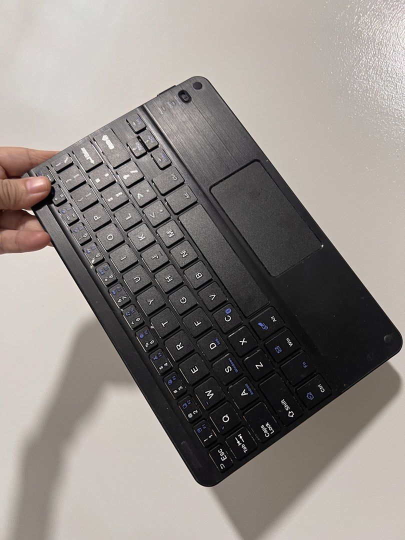 Affordable slim, black wireless Bluetooth keyboard with a built-in touchpad 😍👌🏻 (Category: Computer Keyboard) located in Malolos. Submitted by afford.japan (Listing ID 1466443612, Image 1). Description: Affordable slim, black wireless Bluetooth keyboard with a built-in touchpad 😍👌🏻.