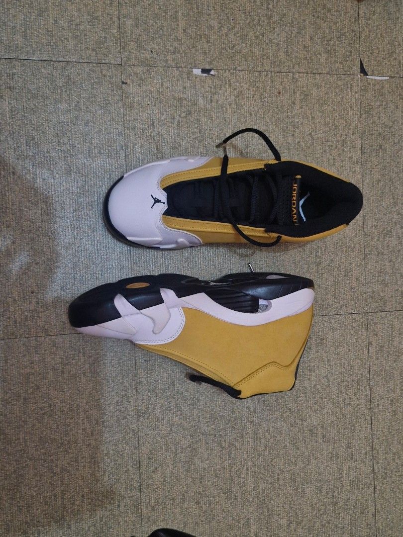 Air Jordan 14 Retro Ginger Wheat Yellow (Category: Sneakers) located in Manila. Submitted by lirililarila_thew (Listing ID 1466453643, Image 3). Description: Air Jordan 14 Retro sneakers in ginger wheat yellow, white, and black colorway. Suede upper with classic Jumpman shield logo on the side and 23 numbering on the heel. Black laces and tongue with Jordan text branding. White leather toe caps. Clean outsoles and solid construction overall..