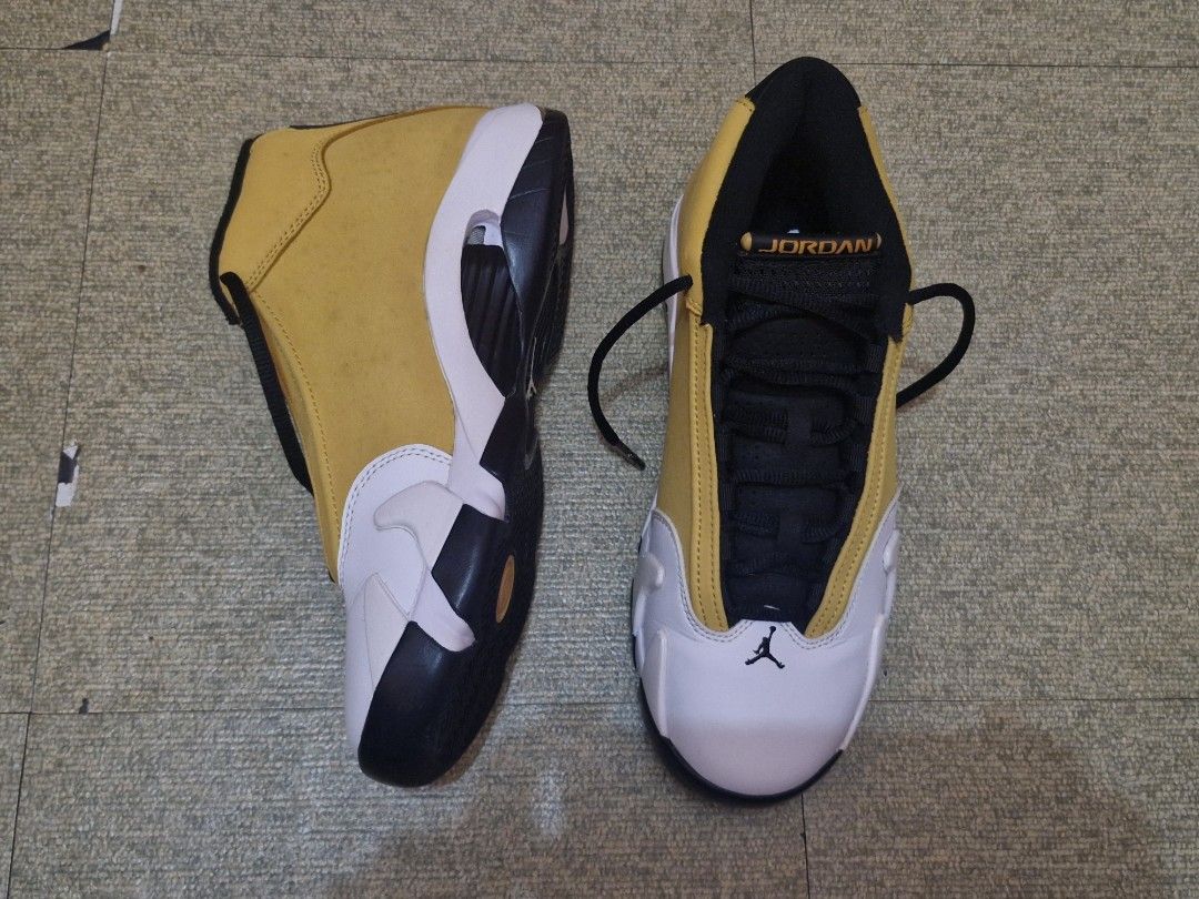 Air Jordan 14 Retro Ginger Wheat Yellow (Category: Sneakers) located in Manila. Submitted by lirililarila_thew (Listing ID 1466453643, Image 1). Description: Air Jordan 14 Retro sneakers in ginger wheat yellow, white, and black colorway. Suede upper with classic Jumpman shield logo on the side and 23 numbering on the heel. Black laces and tongue with Jordan text branding. White leather toe caps. Clean outsoles and solid construction overall..