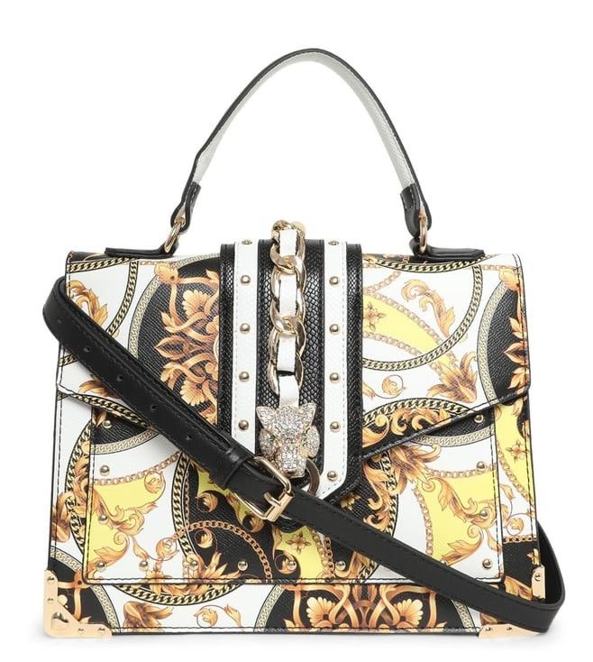 ALDO Barob (Category: Shoulder Bags) located in Bacoor. Submitted by sereeen.cm (Listing ID 1466437000, Image 1). Description: - Bold black, white, and yellow baroque print - Eye-catching rhinestone leopard head clasp closure - Chic gold-tone chain detail on the front flap - Structured faux leather build with a spacious interior - Includes a top handle and an adjustable black shoulder strap - Protective gold metal corner brackets on the base.