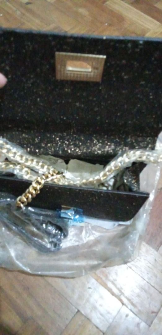 Aldo Glitter Crossbody Bag with Chain Strap (Category: Cross-body Bags) located in Marikina City. Submitted by silentstar_3bba68 (Listing ID 1466480145, Image 2). Description: - Brand: Aldo - Style: Glitter crossbody bag - Color: Dark bronze / black tone with gold-tone hardware - Closure: Flap front with twist lock - Condition: Brand new with original tag (₱4,500) attached, never used - Extras: Chain strap still wrapped in protective plastic, sto