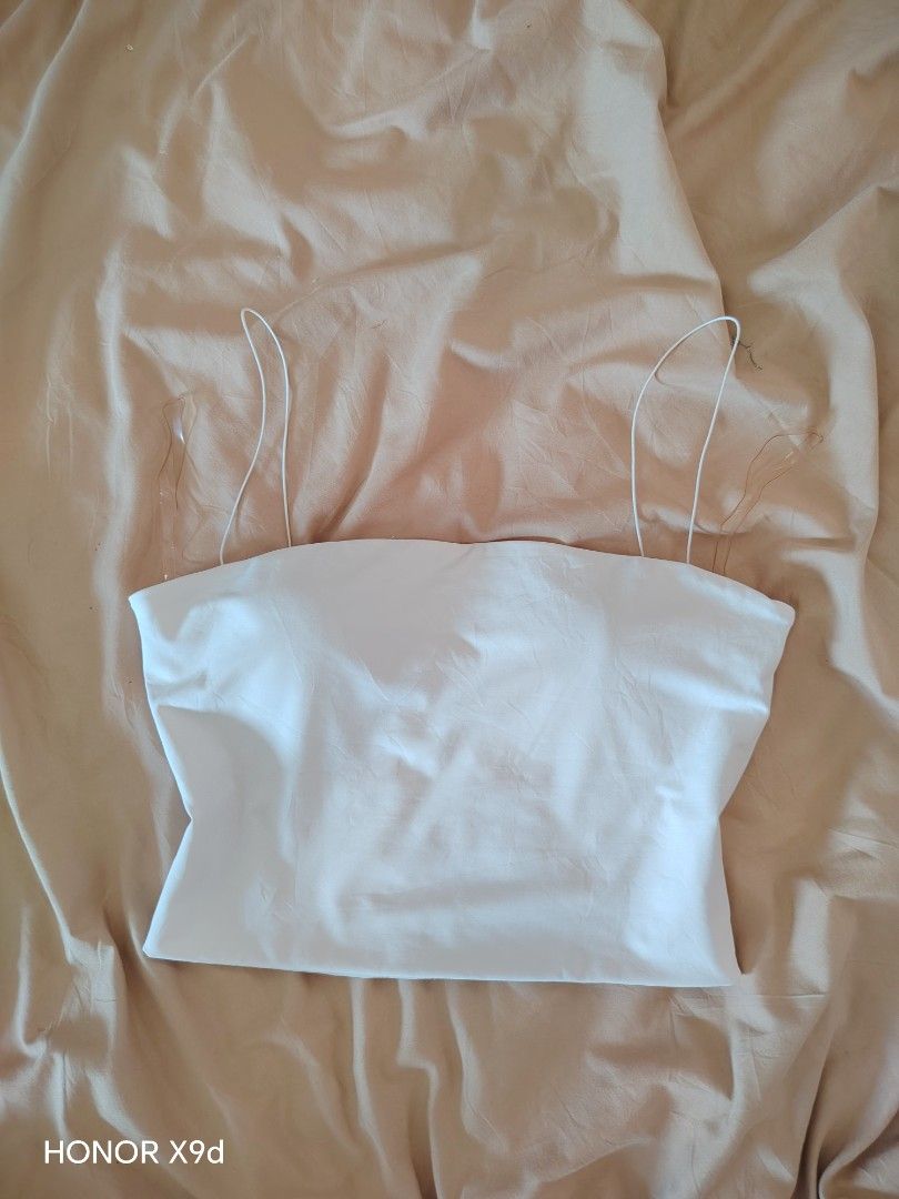 Alex Stevens White Tube Top with Padding and Strap (Category: Sleeveless) located in Mabalacat. Submitted by Jackikay.PreLoved (Listing ID 1466415757, Image 1). Description: - Brand: Alex Stevens - Size: Medium on tag but can fit XS-S - Condition: Brand new, never worn out - Padding: Built-in removable round bra pads - Premium Seamless Quality - Design: Thin white shoulder straps with clear side strap details - Comfort: Super comfortable basic pi