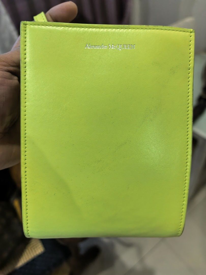 Alexander McQueen (Category: Cross-body Bags) located in Cagayan de Oro. Submitted by tommygurl1218 (Listing ID 1466429584, Image 1). Description: - Brand: Alexander McQueen - Color: Bright neon yellow with contrast stitching - Material: Premium leather with black fabric interior lining - Origin: Made in Italy - Design: Structured vertical shape, silver front lettering, and debossed AM monogram on the back - Mode of Payment: GCash, BPI, or Bank T