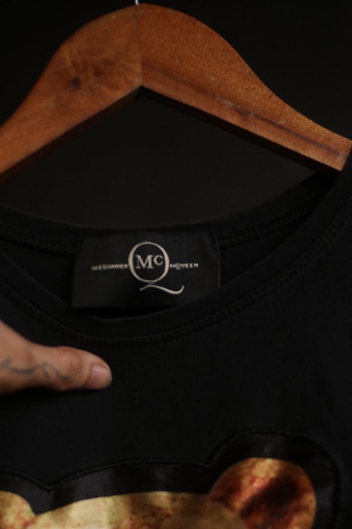 Alexander McQueen Black Bear Graphic T-Shirt (Category: Tshirts & Polo Shirts ) located in Taguig. Submitted by kurim4w (Listing ID 1466443977, Image 3). Description: - Brand: Alexander McQueen - Color: Black - Style: Short-sleeve t-shirt / Standard fit - Material: 100% Cotton - Design: Large teddy bear graphic with sunglasses & bow tie on front; small bear detail on right sleeve - Details: Branded neck label stitched inside - Condition: Clean an