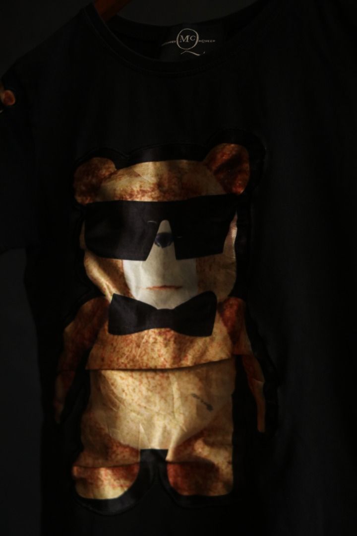 Alexander McQueen Black Bear Graphic T-Shirt (Category: Tshirts & Polo Shirts ) located in Taguig. Submitted by kurim4w (Listing ID 1466443977, Image 2). Description: - Brand: Alexander McQueen - Color: Black - Style: Short-sleeve t-shirt / Standard fit - Material: 100% Cotton - Design: Large teddy bear graphic with sunglasses & bow tie on front; small bear detail on right sleeve - Details: Branded neck label stitched inside - Condition: Clean an