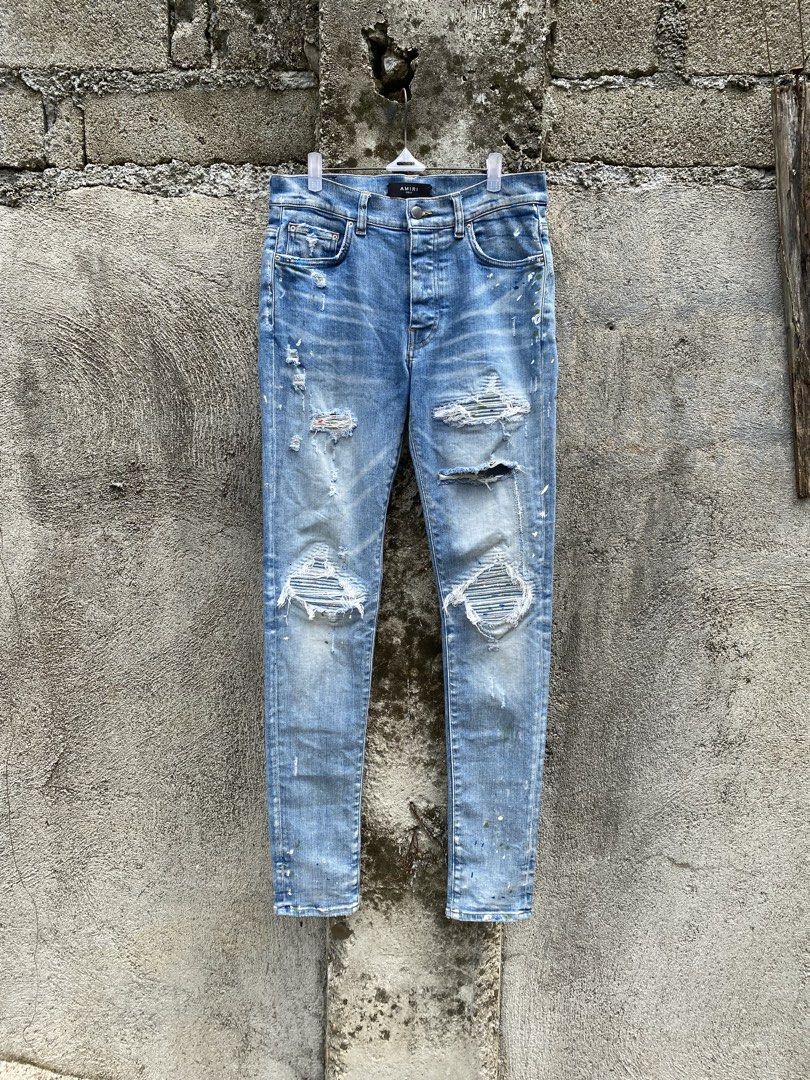 Amiri Distressed Denim pants (Category: Jeans) located in Manila. Submitted by why_notph (Listing ID 1466483313, Image 1). Description: - Classic blue wash denim with stylish contrast orange stitching - Authentic Cobrax Original engraved metal button hardware - Standard weight twill weave fabric for everyday comfort - Sturdy construction featuring reinforced seams along the waistband - Dimensions: W : 31-32 Rise : 13 Leg : 8 Leg opening : 5.5.