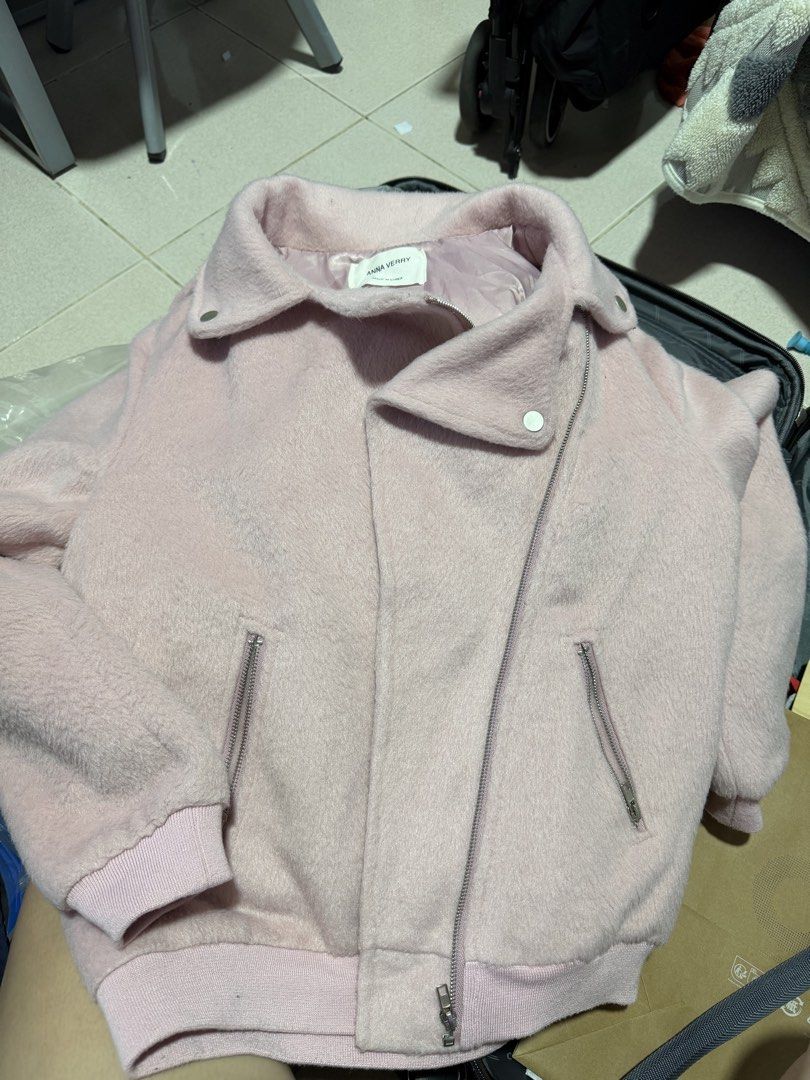 Anna Verry Pink Fuzzy Jacket Autumn (Category: Coats, Jackets and Outerwear) located in Quezon City. Submitted by wonderrv18 (Listing ID 1466446129, Image 1). Description: - Brand: Anna Verry (Made in Korea) - Color/Style: Pink fuzzy winter jacket with asymmetrical front zip - Hardware: Silver-toned accents - Pockets: Two functional front zip pockets - Details: Ribbed knit cuffs and hem for extra warmth - Material: Soft wool-blend texture, EUC.