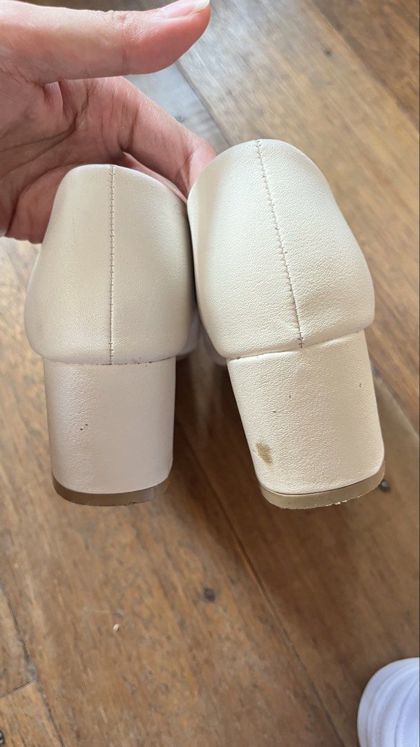 AnZ White Block Heel Pumps Size 37 (Category: Heels) located in Manila. Submitted by ayessaset53754 (Listing ID 1466377954, Image 3). Description: White block heel pumps from AnZ. Size 37. Square toe design with beige inner lining. Chunky low heel provides stable walking support. Issue: Minor scuff marks near the toe tip and a small stain on the heel as pictured. Soles show normal wear from previous use..