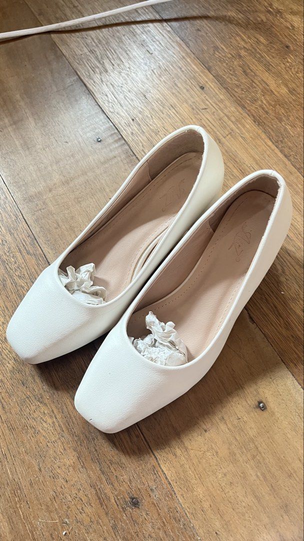AnZ White Block Heel Pumps Size 37 (Category: Heels) located in Manila. Submitted by ayessaset53754 (Listing ID 1466377954, Image 1). Description: White block heel pumps from AnZ. Size 37. Square toe design with beige inner lining. Chunky low heel provides stable walking support. Issue: Minor scuff marks near the toe tip and a small stain on the heel as pictured. Soles show normal wear from previous use..