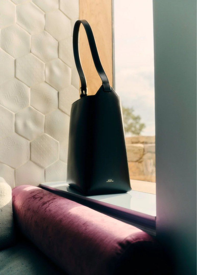 A.P.C. Virginie Bag - Black (Category: Luxury Bags & Wallets) located in Pasig City. Submitted by mschesca (Listing ID 1466408084, Image 1). Description: - Brand: A.P.C. - Material: Premium black smooth leather - Hardware: Gold-tone buckle and subtle gold embossed logo - Design: Minimalist structure with clean open top compartment - Strap: Adjustable for custom fit - Inclusion: Original A.P.C. cotton dust bag - Condition: Barely carried, like new