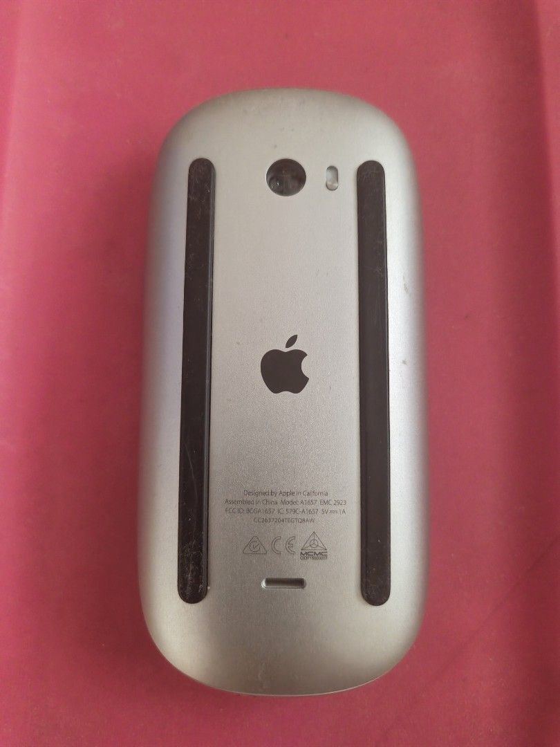 Apple Magic Mouse 2 Model A1657 (Category: Mouse & Mousepads) located in Manila. Submitted by speedshoot58451 (Listing ID 1466563143, Image 2). Description: - Authentic Apple Magic Mouse (Model A1657) - Wireless Bluetooth connection with built-in rechargeable battery - Smooth multi-touch surface for easy gesture controls - Sleek silver aluminum finish matches your Mac setup - Normal wear on the bottom black plastic foot strips from everyday desk 