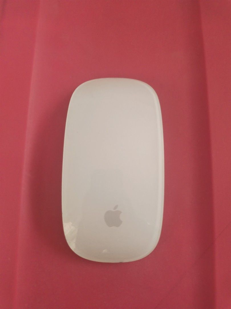 Apple Magic Mouse 2 Model A1657 (Category: Mouse & Mousepads) located in Manila. Submitted by speedshoot58451 (Listing ID 1466563143, Image 1). Description: - Authentic Apple Magic Mouse (Model A1657) - Wireless Bluetooth connection with built-in rechargeable battery - Smooth multi-touch surface for easy gesture controls - Sleek silver aluminum finish matches your Mac setup - Normal wear on the bottom black plastic foot strips from everyday desk 