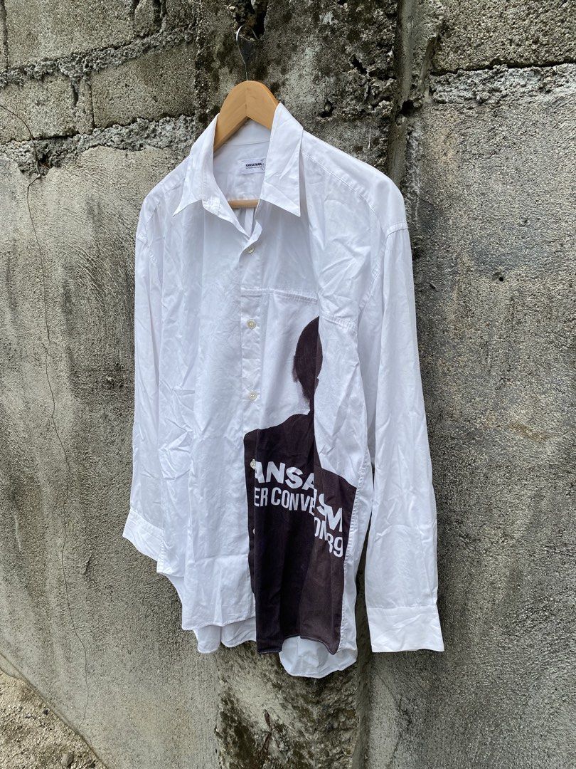 Archive 1989 Kansai Man longsleeves (Category: Tshirts & Polo Shirts ) located in Manila. Submitted by why_notph (Listing ID 1466481263, Image 3). Description: White long-sleeve button-down shirt by Kansai Man Yutaka Nishimura. Graphic print on the lower front reads 'KANSAI ISM SUPER CONVENTION '89'. Classic collar and button cuffs. Minor stains on print part due to its age. Clean white fabric with bold vintage graphic styling. Good piece for col