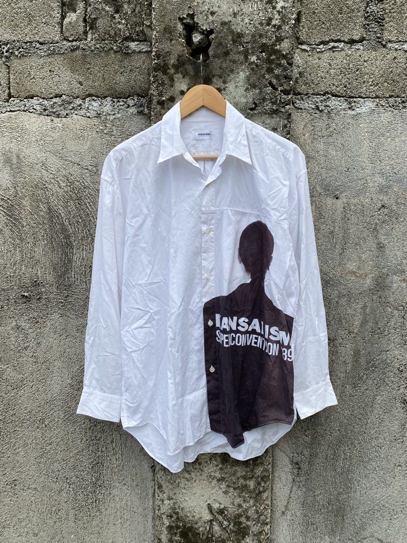 Archive 1989 Kansai Man longsleeves (Category: Tshirts & Polo Shirts ) located in Manila. Submitted by why_notph (Listing ID 1466481263, Image 1). Description: White long-sleeve button-down shirt by Kansai Man Yutaka Nishimura. Graphic print on the lower front reads 'KANSAI ISM SUPER CONVENTION '89'. Classic collar and button cuffs. Minor stains on print part due to its age. Clean white fabric with bold vintage graphic styling. Good piece for col