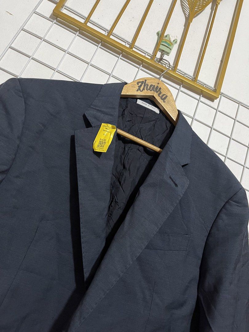 Armani Collezioni G Line Suit Jacket Blazer (Category: Coats, Jackets and Outerwear) located in Pagsanjan. Submitted by zhairaaaaa (Listing ID 1466479951, Image 3). Description: - Brand: Armani Collezioni (G Line) - Color: Dark charcoal grey - Origin: Made in Italy - Material: High-quality wool blend - Design: Classic two-button closure, notched lapels, front flap pockets, single back vent - Interior: Fully lined with internal pockets - Condition
