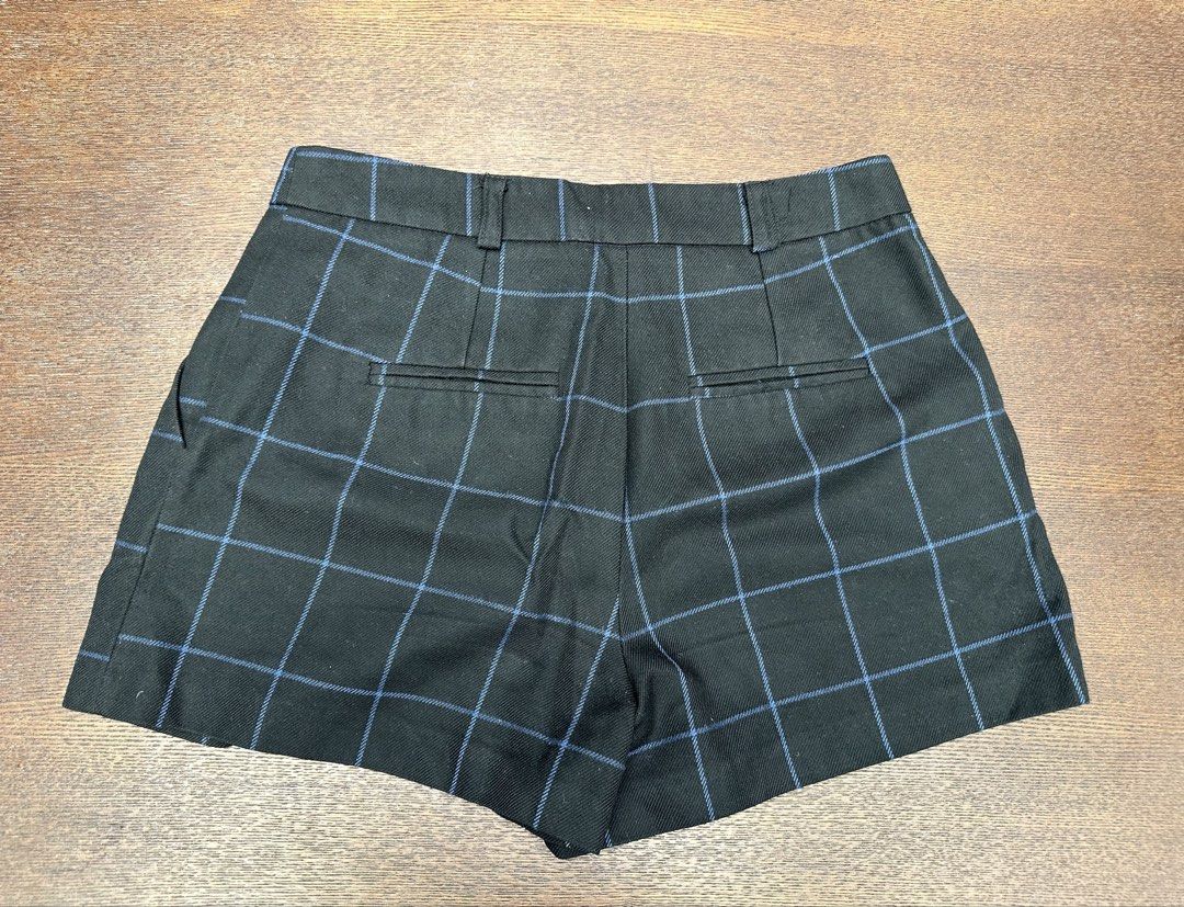 ASOS Black Blue Plaid Check Tailored Shorts (Category: Shorts) located in Bulacan. Submitted by thriftbagcollections (Listing ID 1466356455, Image 2). Description: - Brand: ASOS - Size: UK 8 / EU 36 / US 4 - Color: Black with blue plaid check pattern - Waist: Mid-rise with belt loops - Details: Pleated front and back welt pockets - Condition: Excellent structured style, perfect for casual or dressed-up looks.