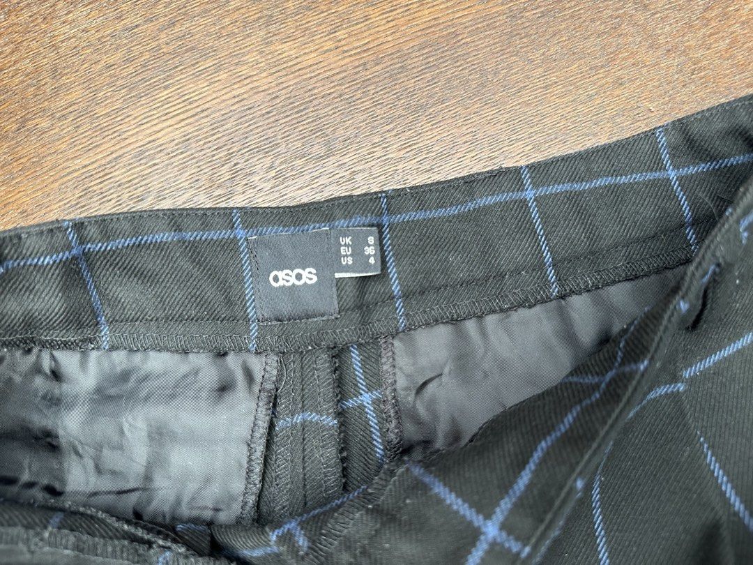 ASOS Black Blue Plaid Check Tailored Shorts (Category: Shorts) located in Bulacan. Submitted by thriftbagcollections (Listing ID 1466356455, Image 3). Description: - Brand: ASOS - Size: UK 8 / EU 36 / US 4 - Color: Black with blue plaid check pattern - Waist: Mid-rise with belt loops - Details: Pleated front and back welt pockets - Condition: Excellent structured style, perfect for casual or dressed-up looks.