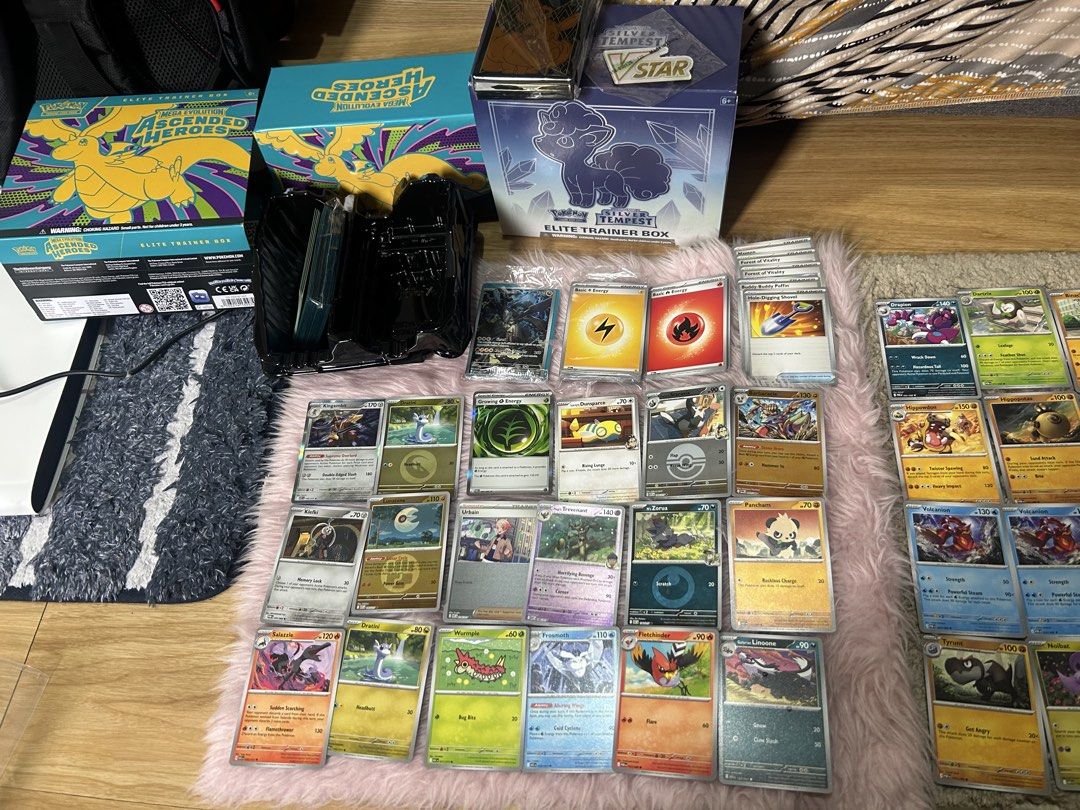Assorted characters (Category: Raw Singles) located in Cavite. Submitted by zacharyyy__ (Listing ID 1466436316, Image 2). Description: For sale rush for take all 2500 pesos only Ascended heroes box includes: - Zekrom promo card sealed - Dice sealed - Energy cards sealed - Card sleeves sealed - Redeem cards 6 pcs Silver tempest box includes: - Vstar badge - 2 coins - Dice sealed - Energy cards sealed - Card sleeves sealed - Redeem cards 7 pcs Incl