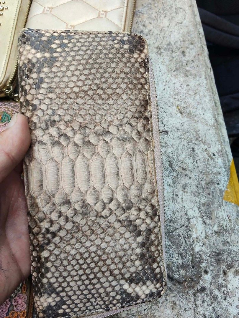 Assorted wallets and pouches lot collection (Category: Wallets & Card holders) located in Caloocan City. Submitted by kaymatias (Listing ID 1466410089, Image 2). Description: - Bundle includes assorted wallets, pouches, and card holders - Features mixed materials: textured leather, snake skin pattern, and checkerboard canvas - Unique details: floral embroidery and metal hardware - Styles range from zip-around to flap designs in various colors - S