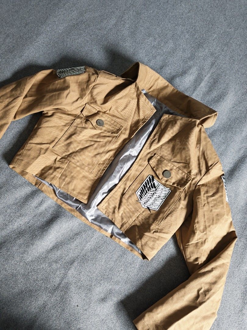 Attack on Titan Survey Corps Scout Regiment Cosplay Jacket (Category: Coats, Jackets and Outerwear) located in Manila. Submitted by goku_doggo (Listing ID 1466364356, Image 1). Description: - Attack on Titan Scout Regiment tan cropped cosplay jacket - Iconic Wings of Freedom logo on back, both shoulders, and front pocket flap - Ideal for Halloween, anime conventions, and costume parties.