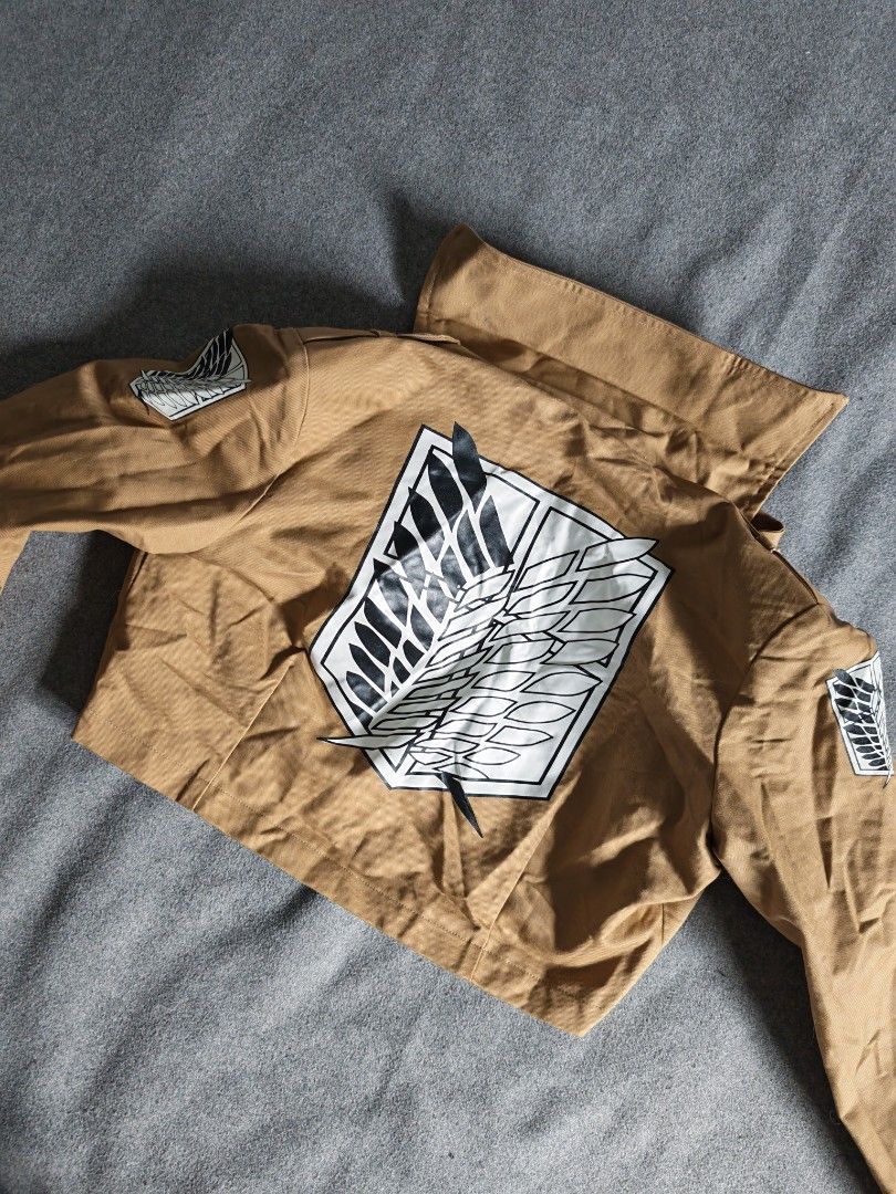 Attack on Titan Survey Corps Scout Regiment Cosplay Jacket (Category: Coats, Jackets and Outerwear) located in Manila. Submitted by goku_doggo (Listing ID 1466364356, Image 3). Description: - Attack on Titan Scout Regiment tan cropped cosplay jacket - Iconic Wings of Freedom logo on back, both shoulders, and front pocket flap - Ideal for Halloween, anime conventions, and costume parties.