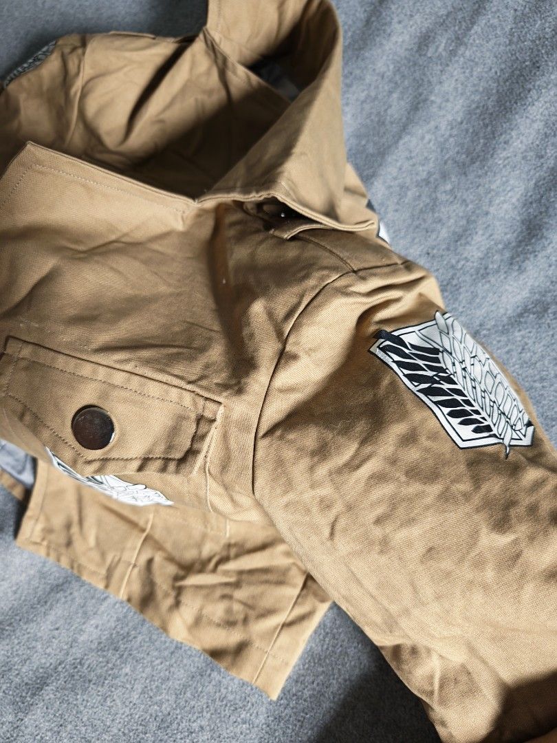 Attack on Titan Survey Corps Scout Regiment Cosplay Jacket (Category: Coats, Jackets and Outerwear) located in Manila. Submitted by goku_doggo (Listing ID 1466364356, Image 2). Description: - Attack on Titan Scout Regiment tan cropped cosplay jacket - Iconic Wings of Freedom logo on back, both shoulders, and front pocket flap - Ideal for Halloween, anime conventions, and costume parties.