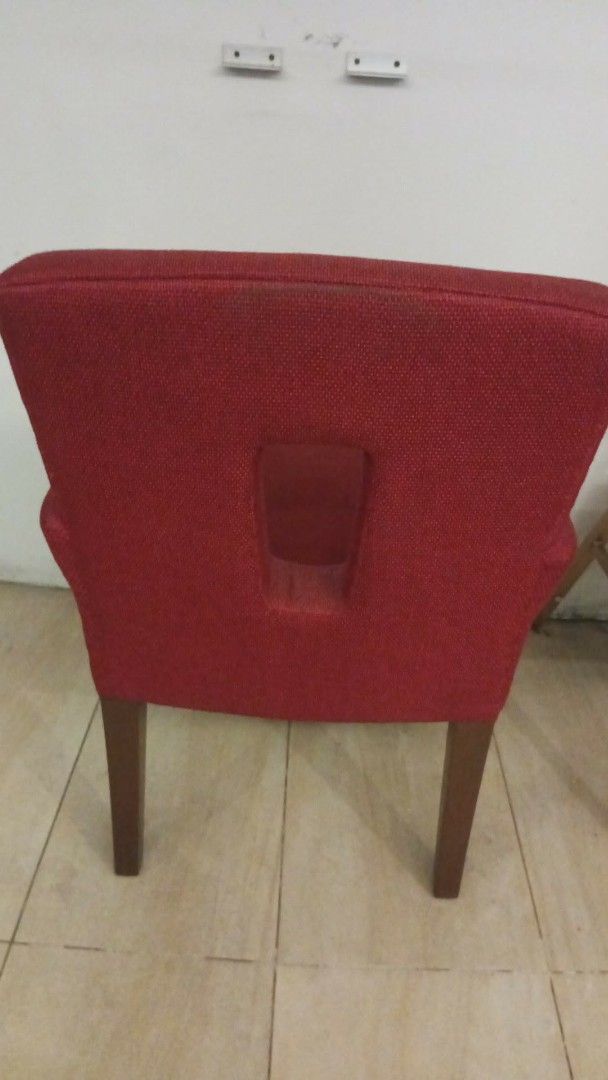 Attractive Red Upholstered Armchair with Cutout Back (Category: Chairs) located in Las Pinas. Submitted by jesus1smysavi0r (Listing ID 1466367148, Image 3). Description: - Bold red upholstered armchair with stylish textured fabric - Unique rectangular cutout window detail on the backrest - Solid wood frame and legs in a neutral brown finish - Supportive armrests for maximum comfort - Versatile accent piece ideal for living rooms, bedrooms, or stu