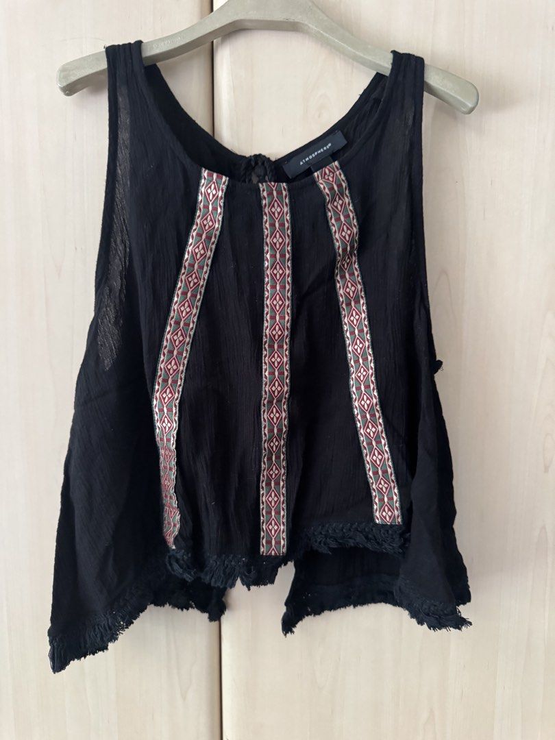 AUTH ATMOSHPHERE BOHO CHIC BLACK NICE MATERIAL AND BACK TIE ACCENT TOP BLOUSE (Category: Sleeveless) located in Pasig City. Submitted by babyiceice (Listing ID 1466363935, Image 1). Description: NO MEETS UPS***NO TRADES***NO WHEN WORN PICTURE***NO MEASUREMENTS PLS READ THE DESCRIPTION CAREFULLY AND LOOK AT THE PICTURES POSTED, NO COMPLAINTS OR REFUND WILL BE ENTERTAINED WITH ANY OF THE FLAWS POSTED OR PICTURED. ALL SALES FINAL NO RETURN NO EXCHAN