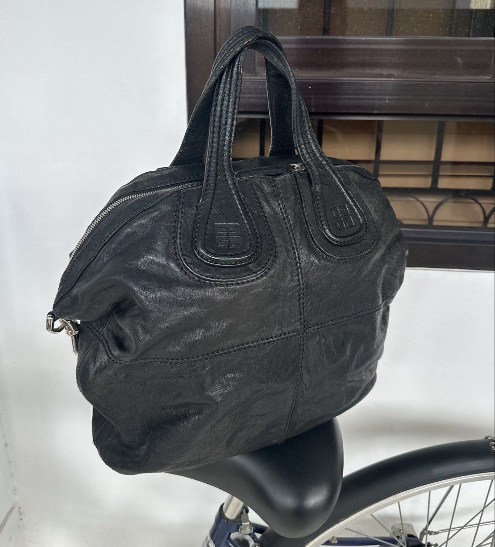 Auth Givenccchhhy Nightingale Black (Category: Luxury Bags & Wallets) located in San Pablo. Submitted by angiemac0921 (Listing ID 1466342437, Image 3). Description: Issue: Handle needs repair on edges Signs of usage (lighten spots) Please manage expectation since this is used bag. With long strap No dust bag.