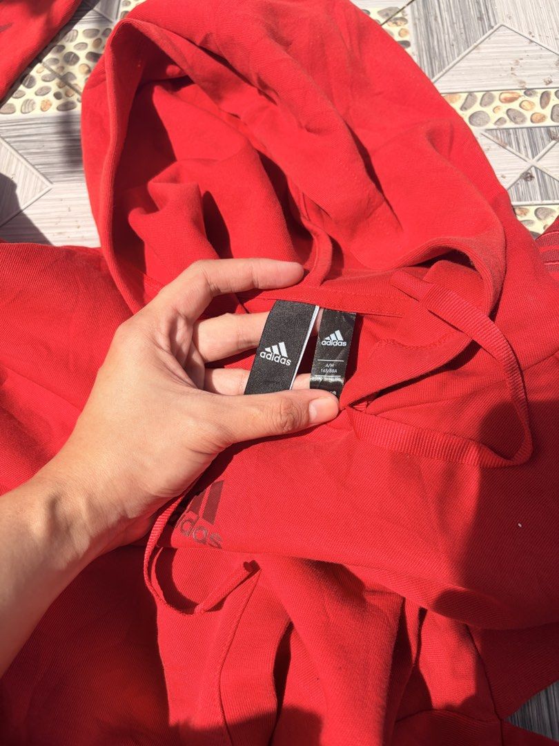 54. Authentic Adidas MIC GFX Pullover Hoodie Red (Size Asian M) (Category: Coats, Jackets and Outerwear) located in Manila. Submitted by athenabrave (Listing ID 1466392890, Image 3). Description: Selling this authentic, vibrant red Adidas pullover hoodie from their special MIC GFX line (released for the Chinese New Year collection). Features a really unique graphic pattern overlay down both sleeves that gives it a standout look. Super comfortable