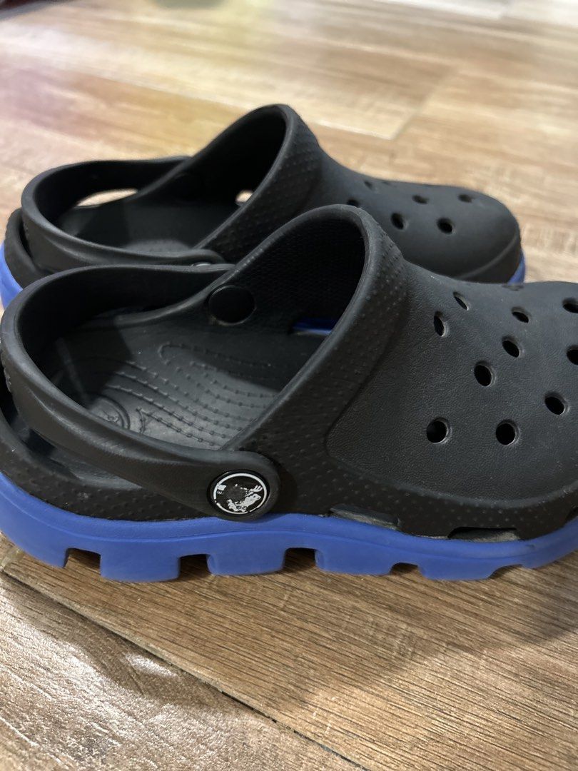 Authentic Crocs Echo Clog Black Blue sz J2 (Category: Babies & Kids Fashion) located in San Fernando. Submitted by gisellelynn77 (Listing ID 1466562863, Image 3). Description: - Color: Black with stylish blue chunky soles - Breathability: Ventilation ports on top to keep feet cool - Fit: Pivotable turbo heel straps for a secure, adjustable fit - Material: Lightweight Croslite construction all around - Convenience: Easy to slip on and off for dail