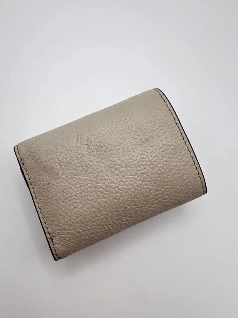 Authentic MK Compact trifold wallet in ivory color. (Category: Wallets & Card holders) located in Cagayan de Oro. Submitted by borse_de_amore (Listing ID 1466424628, Image 2). Description: Authentic MK Compact trifold wallet in ivory color. Rank A pa only flaws is pressmarks. Very cute can fit in small bags 🏷️1,580.